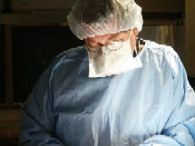 Dr. Henry Wiles operating on a patient