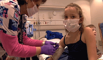Nurse cleans Alicia Langs IV